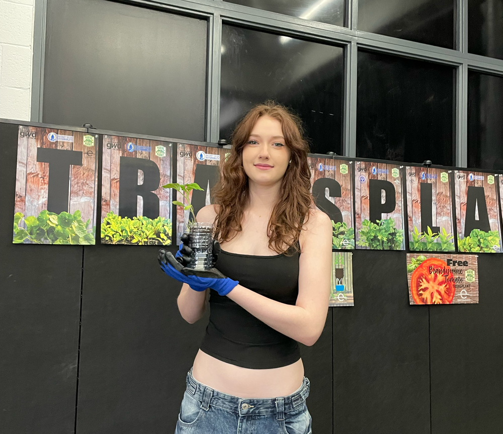 picture of angelina similing and holding a jiffy pots